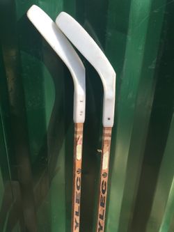 2 kids street hockey sticks