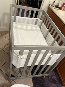 Brand new mini crib