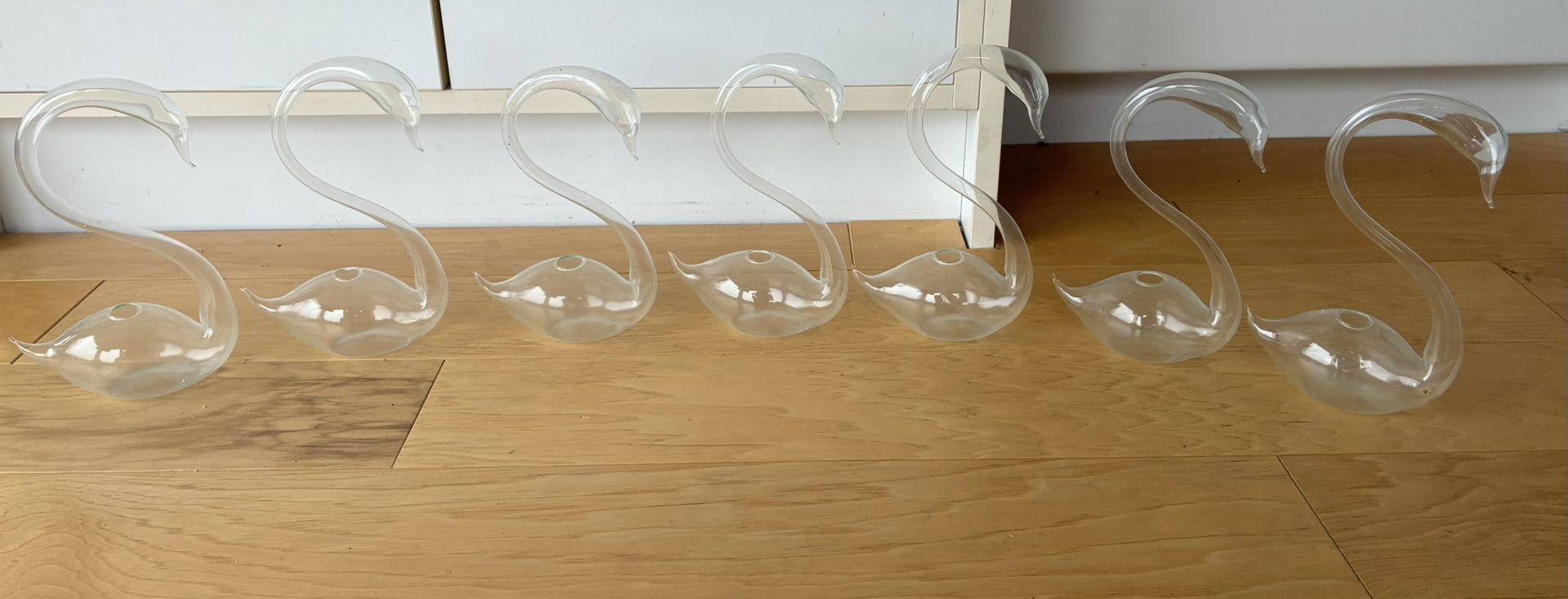 7 Plastic Swans, They Can Hold Liquid.