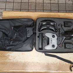 DJI FPV DRONE WITH 2 EXTRA BATTERIES, 3 PORT CHARGING STATION, AND HARD CASE BACKPACK STORAGE