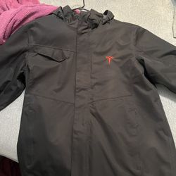 Black Tesla Rain Jacket. 