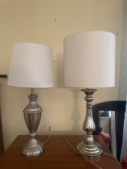 Urn/baluster-style base in a brushed nickel finish.  And. Candlestick-style base lamp