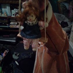 Vintage Porcelain Doll in Swing