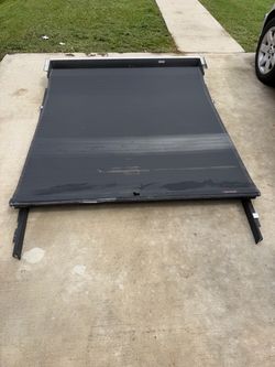 Roll-N-Lock Retractable Truck Bed Cover/Tapa para troca