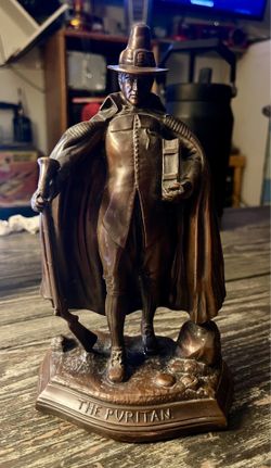 Vintage “The Puritan” cast metal statue