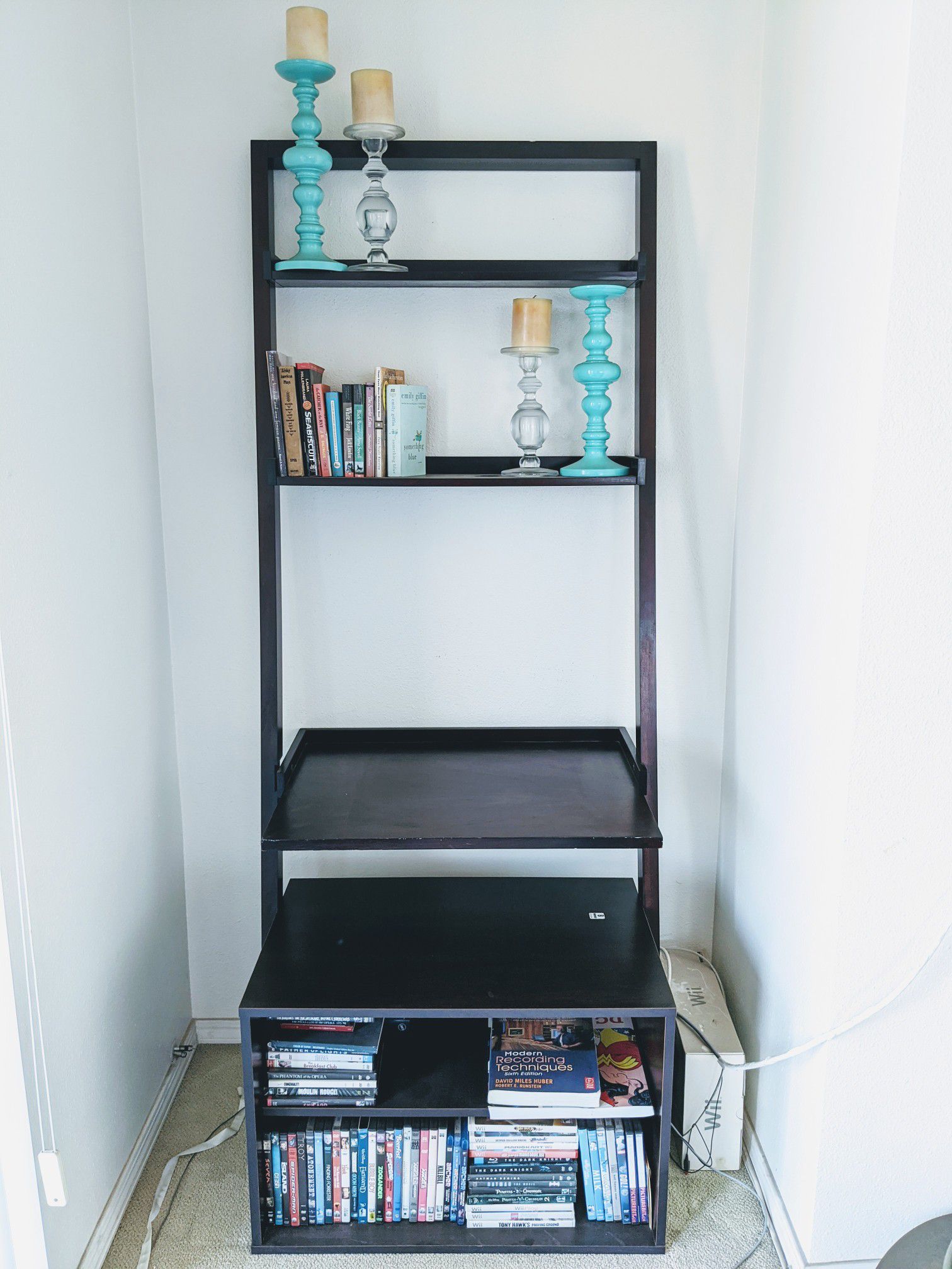 Dark wood ladder desk leaning wall desk and entertainment shelves