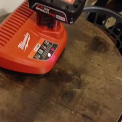 Milwaukee M12 charger with M12 red lithium XC 4.0