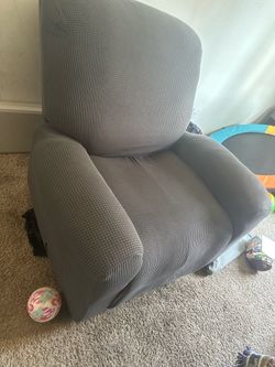 Gray covers on brown recliner