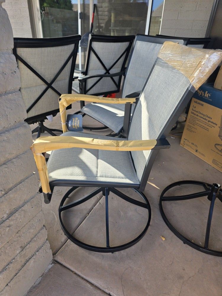 4 Brand New In Box Swivel Patio Chairs