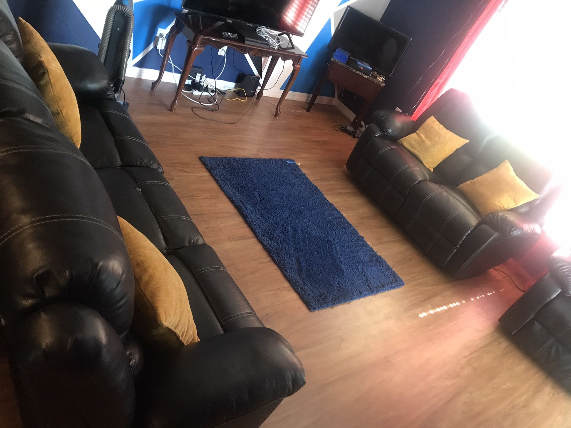 Two reclinable couches black leather