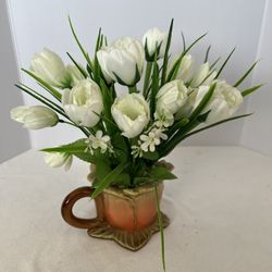 vintage or antique ceramic teacup planter with artificial white tulips