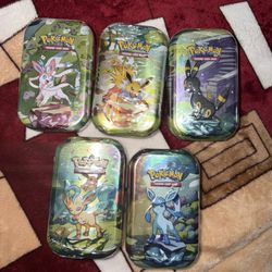 Pokemon Prismatic Evolutions Tins