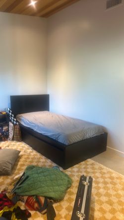 Black Ikea wooden bed frame