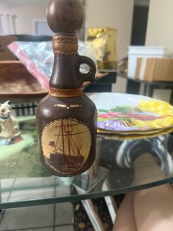 Vintage Leather-Wrapped Decorative Bottle with Ship Motif