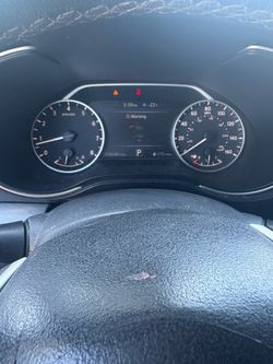 Black Nissan Maxim 3.5sv rebuilt title