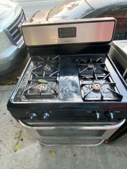 FRIGIDAIRE 4-BURNERS STOVE, STAINLESS STEEL. FREE DELIVERY AND INSTALLATION