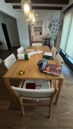 Solid wood table with leather chairs