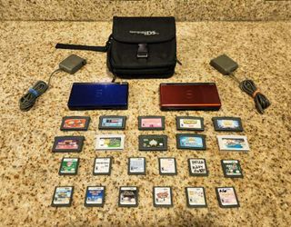 2 Nintendo DS Lites with 20+ GAMES, Chargers, carrying case and More!! (Read the Description Plz)