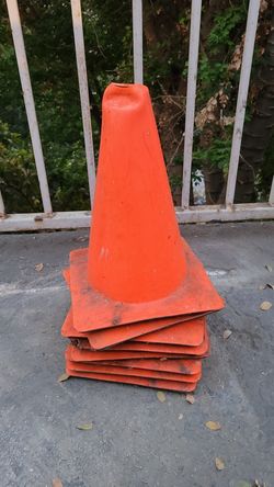 Used dusty dirty small bright orange cones