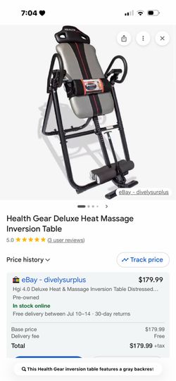 This Health Gear inversion table features a gray backrest with a red center stripe and black metal frame