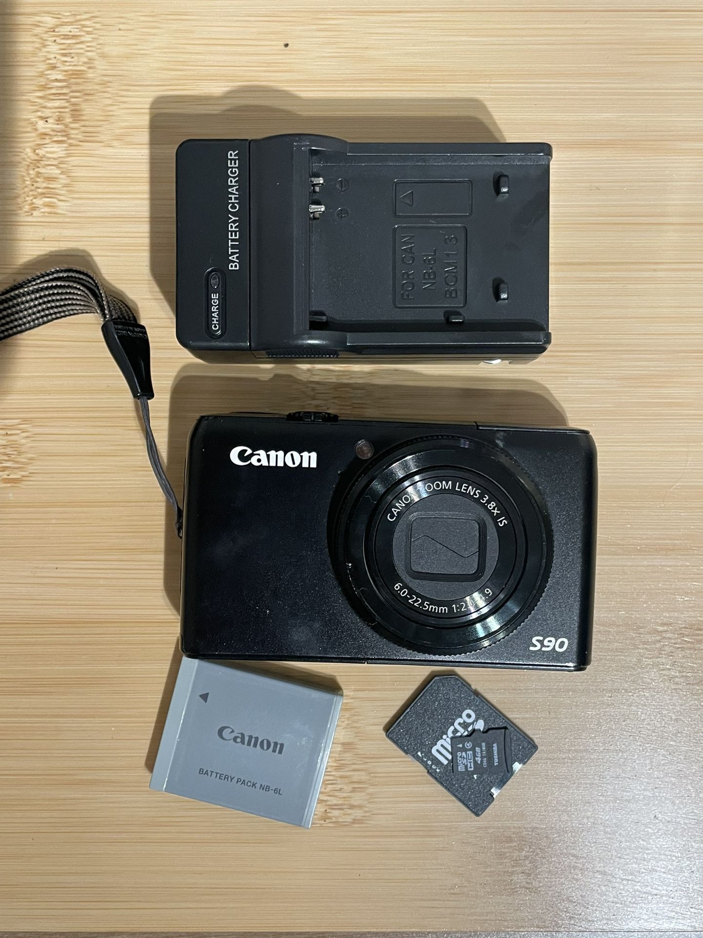 Canon Powershot S90 10 MP Black Digital Camera - Tested Works  Flash zoom video photo all working. Includes battery, charger and 4GB memory card