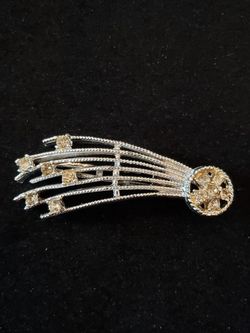Vintage rhinestone shooting star hair clip pin. 2.5-in long and 1-in wide.