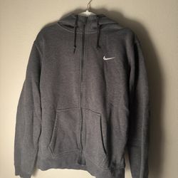 Grey Nike zip-up hoodie with embroidered white logo