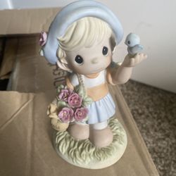 retired Precious Moments piece titled "May - Hawthorn, Bright & Hopeful