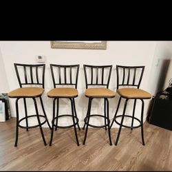 Four Bar-height Swivel Chairs (Stools)