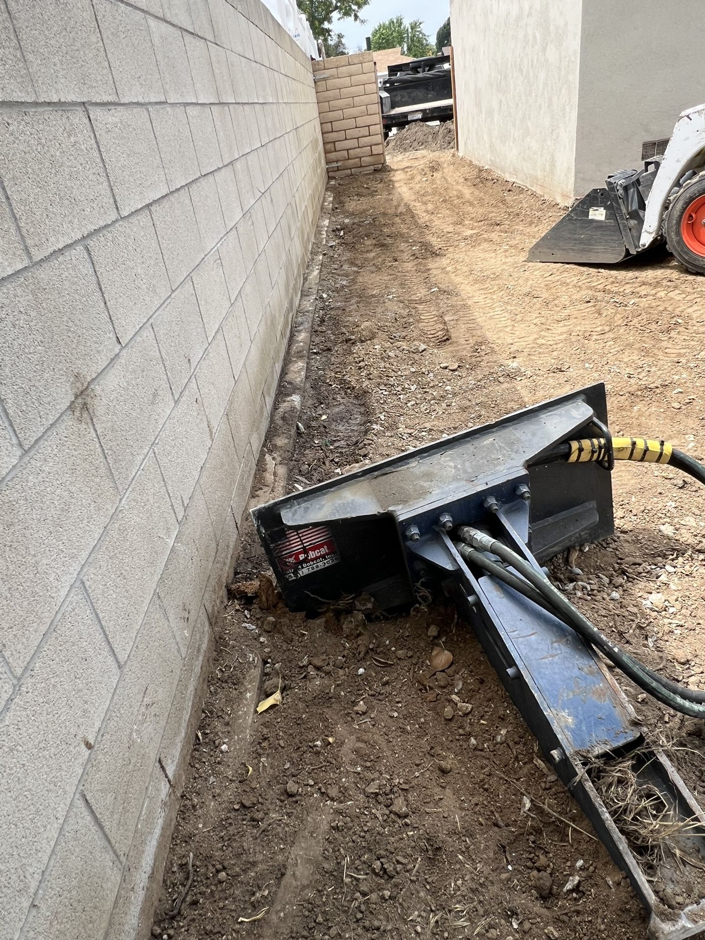Bobcat And Excavator