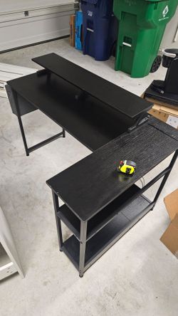 Black L shape Computer desk.