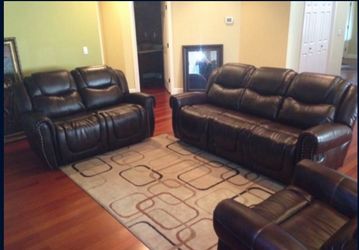 Brown leather fully reclining three piece couch set
