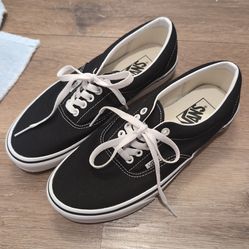 Vans Era classic low-top sneakers in black and white.