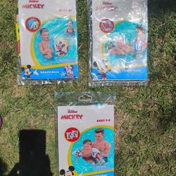 Mickey mouse pool ring, armbands, and beach ball $3 each