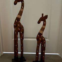 Carved wood giraffes