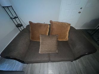 small couch with pillows
