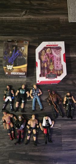 Autographed Undertaker And Ric Flair Wwe Figures