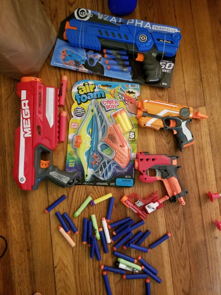 Nerf guns, some new, with extra darts.