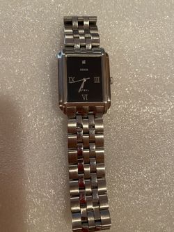 Guess fashion watch. Stainless steel band. Good condition. Needs battery
