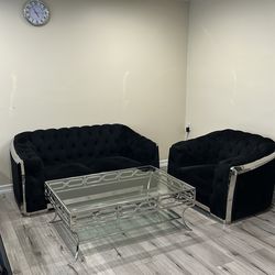 Black couch and glass table