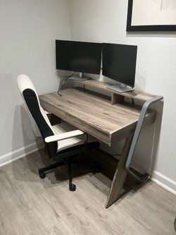 Computer desk office setup with chair