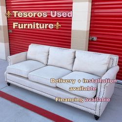 Light beige nailhead sofa