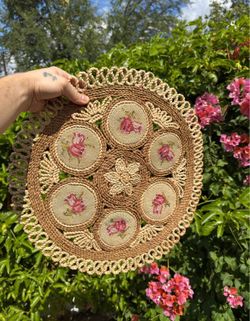 Vintage woven raffia and wicker table centerpiece mat with needlepoint inserts