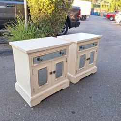 Furniture: A pair of two-door, one-drawer nightstands. 