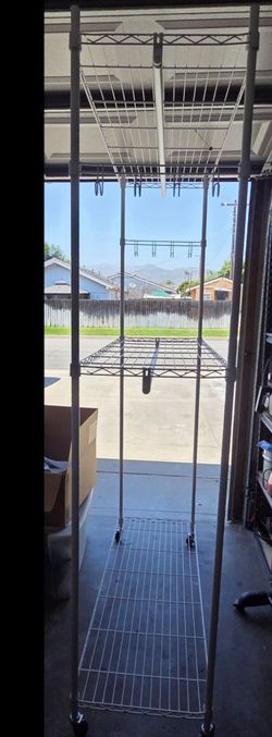 2 Tier clothing rack with wheels OBO