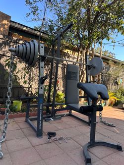 OLYMPIC SQUAT RACK WITH OLYMPIC WEIGHTS AND BENCH