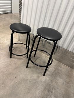 Two metal stools, 20 inch high and 24 inch high $30 for both