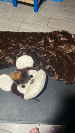 Dogs let costume of a monkey