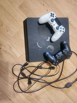 PlayStation 4 Slim Console with Two Controllers