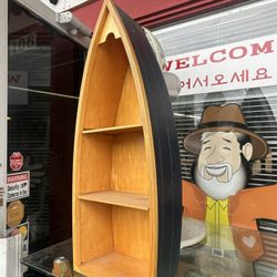 Nautical-themed wooden boat shelf